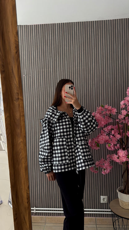 Veste à carreaux noir et blanche
